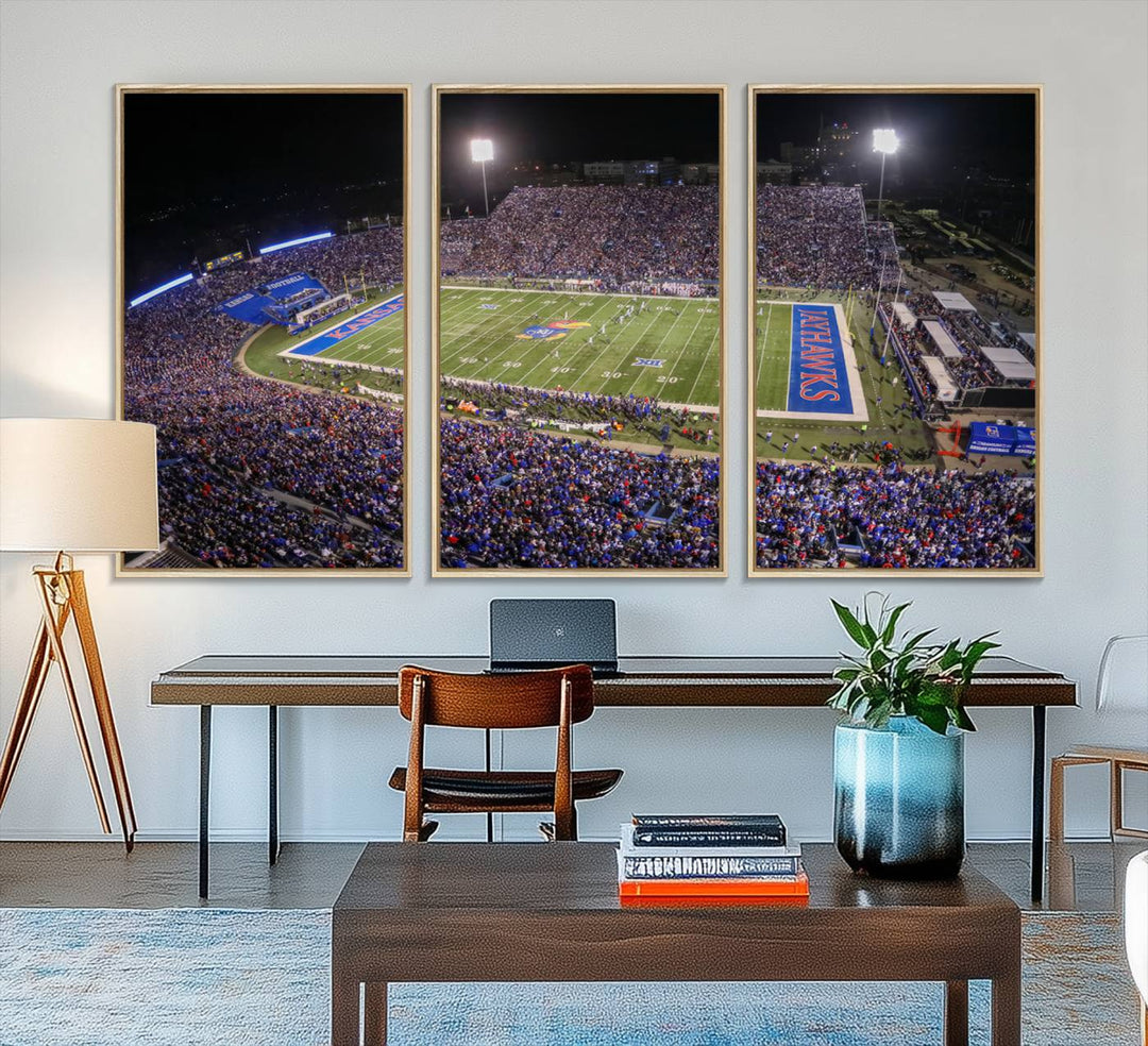 A canvas depicting an aerial view of the University of Kansas Memorial Stadium, showcasing bright lights and a lush green field at night.