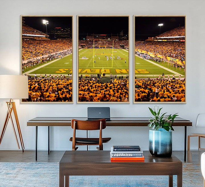 The Phoenix Stadium Canvas Wall Art features a vibrant depiction of a packed stadium filled with ASU Sun Devils fans wearing yellow shirts.