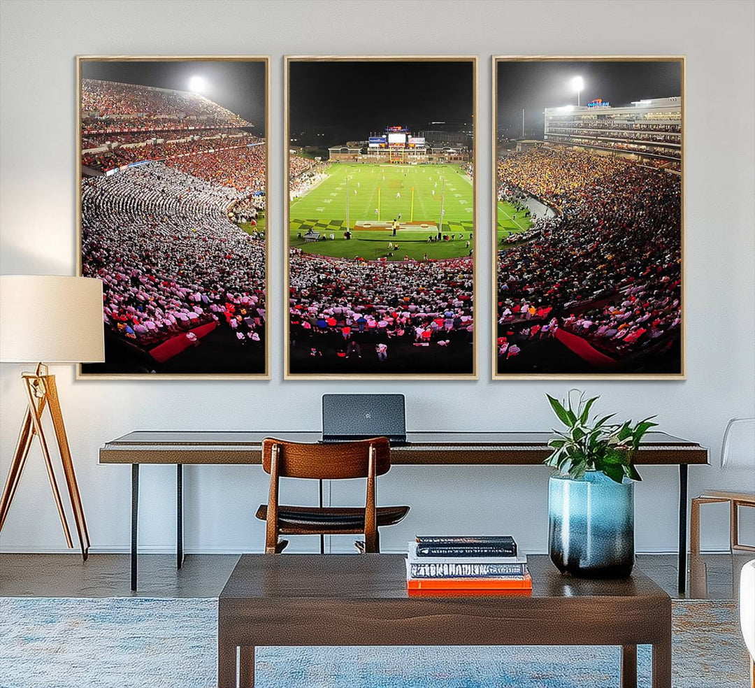 The Maryland Terrapins Football Wall Art Canvas showcases a packed SECU Stadium at night with a bright field and cheering fans.