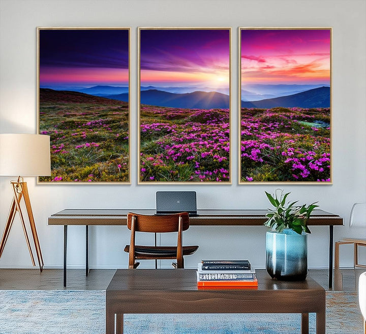 A 3-panel landscape photography canvas of a sunset over mountain meadows with purple wildflowers decorates the wall.