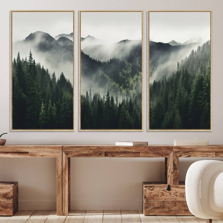 The Misty Forest Canvas Print Wall Art captures a serene misty forest scene with fog and mountains.