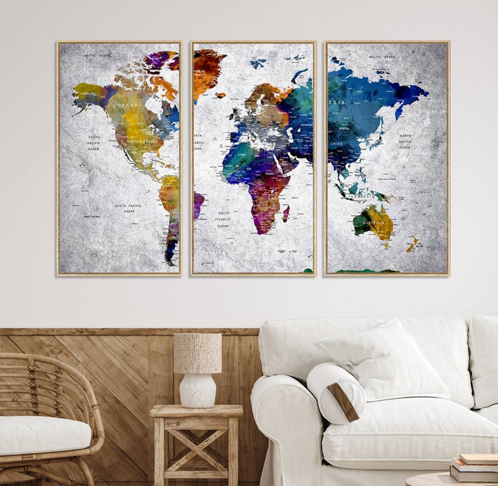 The World Map Art Canvas Print, featuring country names on a grunge-stained gray background, is perfect for stylish home decor.