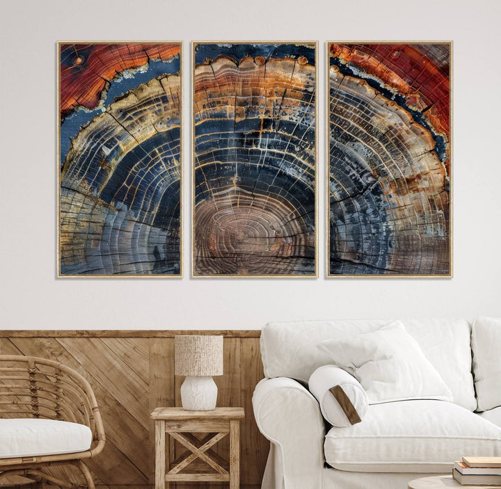 The Abstract Tree Ring Wall Art in orange, blue, and gray perfectly complements minimalist nature-inspired home decor.