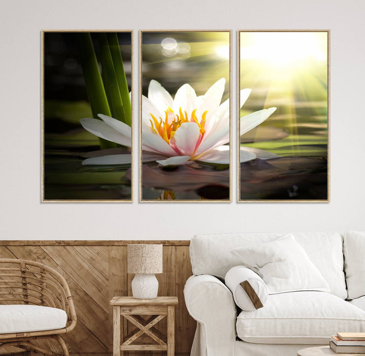 The Lotus Flower Wall Art Canvas Print showcases a white water lily with a yellow center floating gracefully in sunlight.