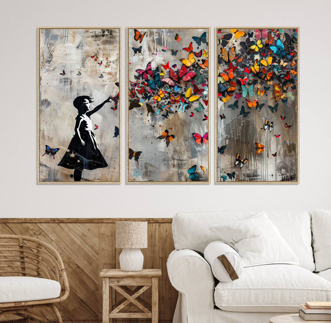 The Banksy Butterfly Girl 3-Piece Modern Graffiti Canvas Wall Art features a silhouette of a girl reaching for butterflies.