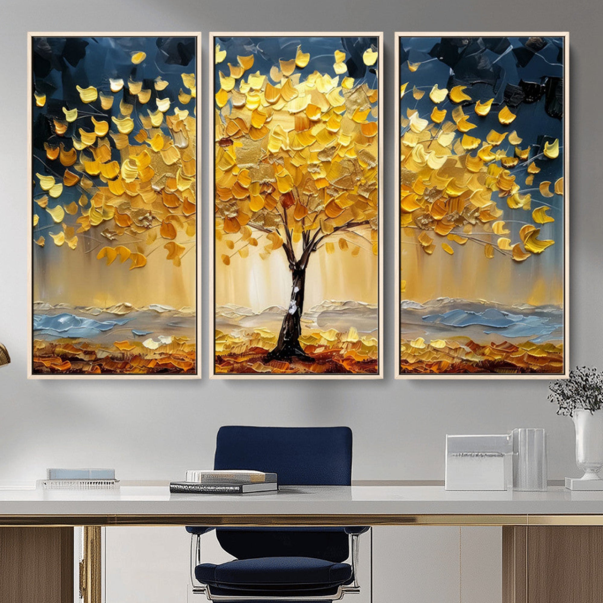 Canvas of a golden autumn tree with textured brushstrokes and moody blue skies, perfect for dramatic and vibrant home decor.
