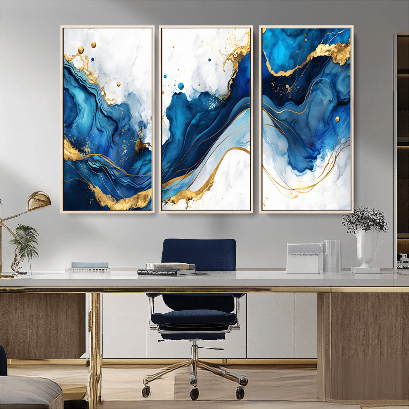 Elegant abstract canvas in cobalt blue and gold tones, featuring marble waves and fluid motion, ideal for luxe interior styling.