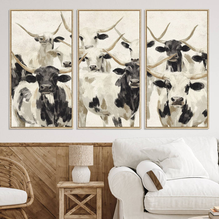 Canvas print titled Longhorn Texas Cow Drawing, depicting longhorn cattle with black and white markings, made in the USA, displayed on the wall.