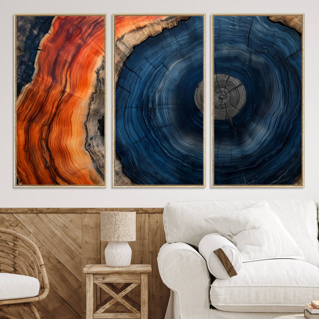 Abstract Tree Ring Wall Art Print on canvas featuring vibrant blue, orange, and brown rings with a natural rustic wood texture. Free shipping available!.