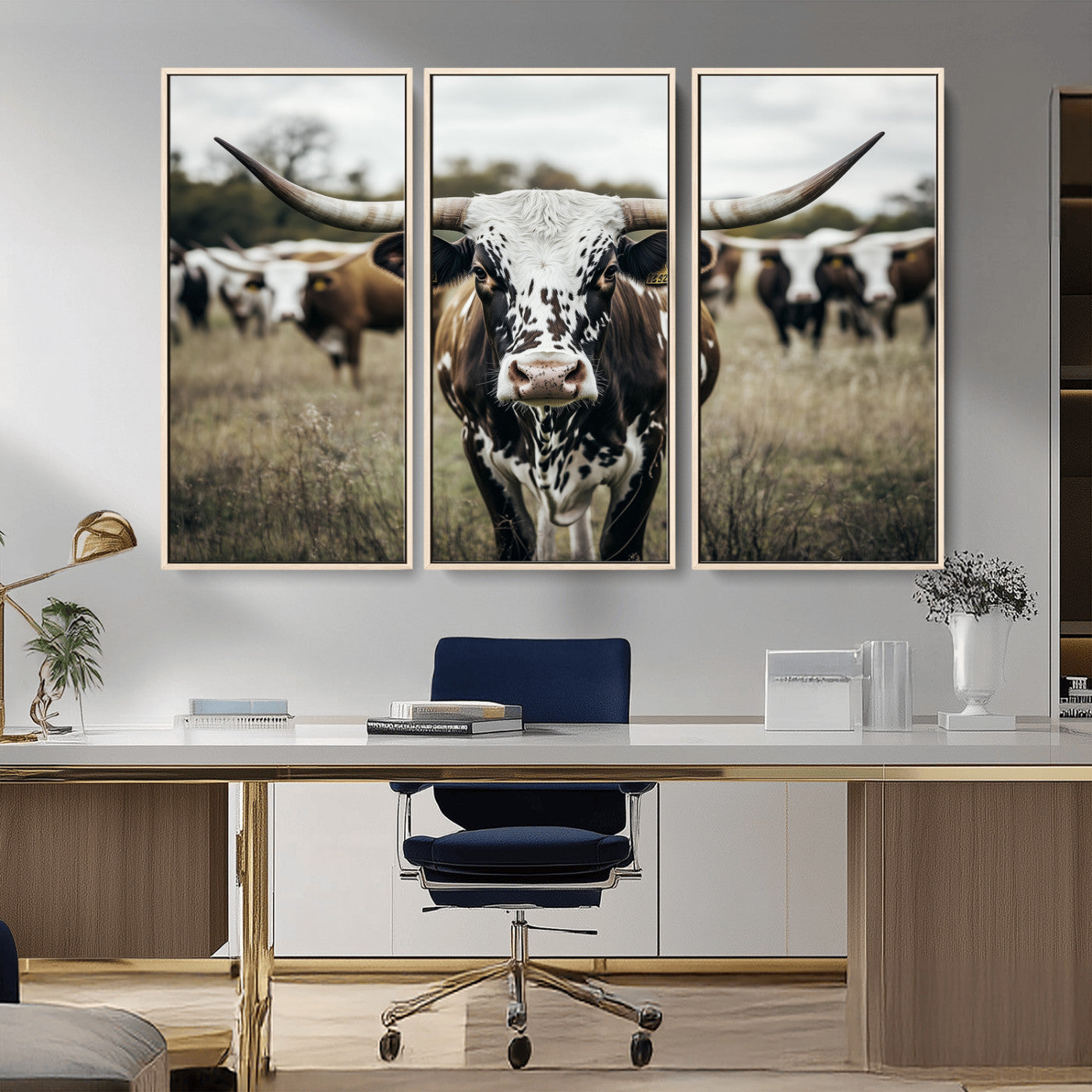 Canvas of a speckled Texas longhorn standing boldly in a field with a herd behind, perfect for rustic western or farmhouse wall decor.