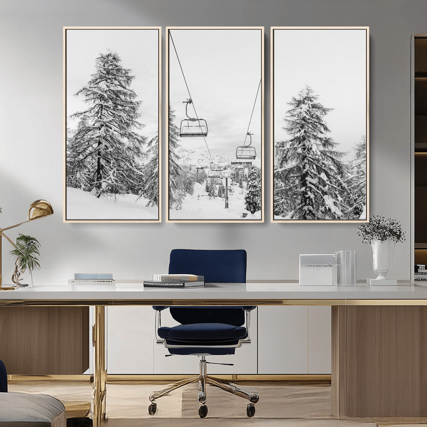 Black and white image of a ski lift amidst snow-covered pine trees, ideal for winter mountain or cabin-themed decor.