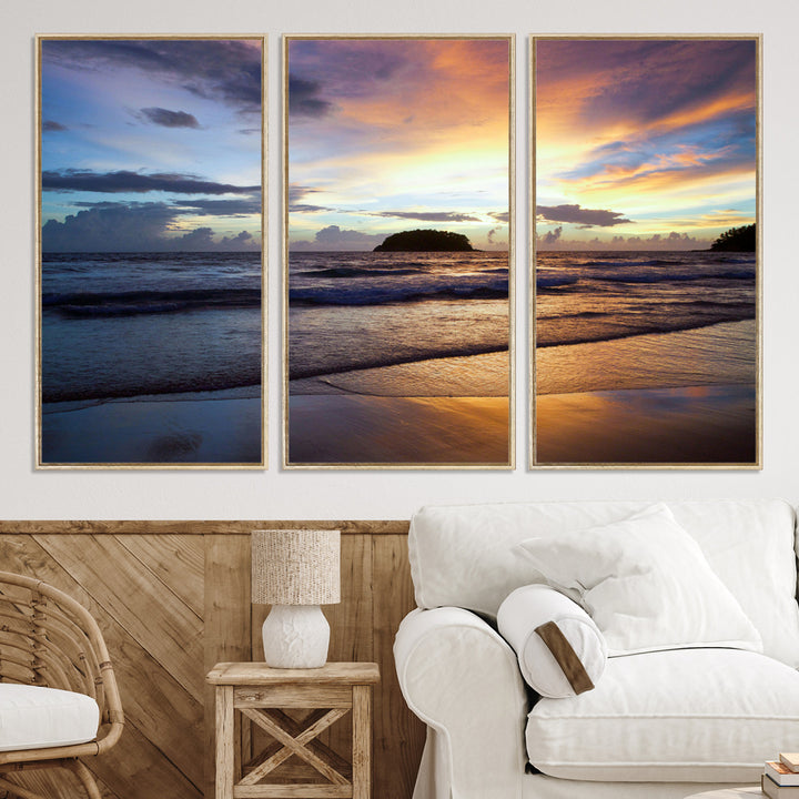 A tropical beach at sunset with waves gently washing ashore, reflecting golden and purple hues in the sky, creating a tranquil coastal scene.