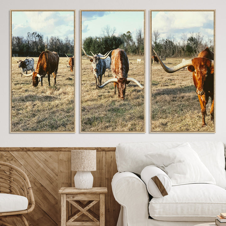 A herd of Texas Longhorn cattle grazing in an open field under a partly cloudy sky, capturing a rustic and Western ranch aesthetic.
