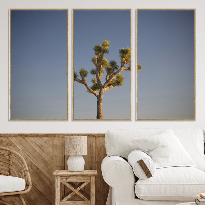 A lone Joshua Tree standing against a deep blue sky, capturing the serene and rugged beauty of the Southwestern desert landscape.