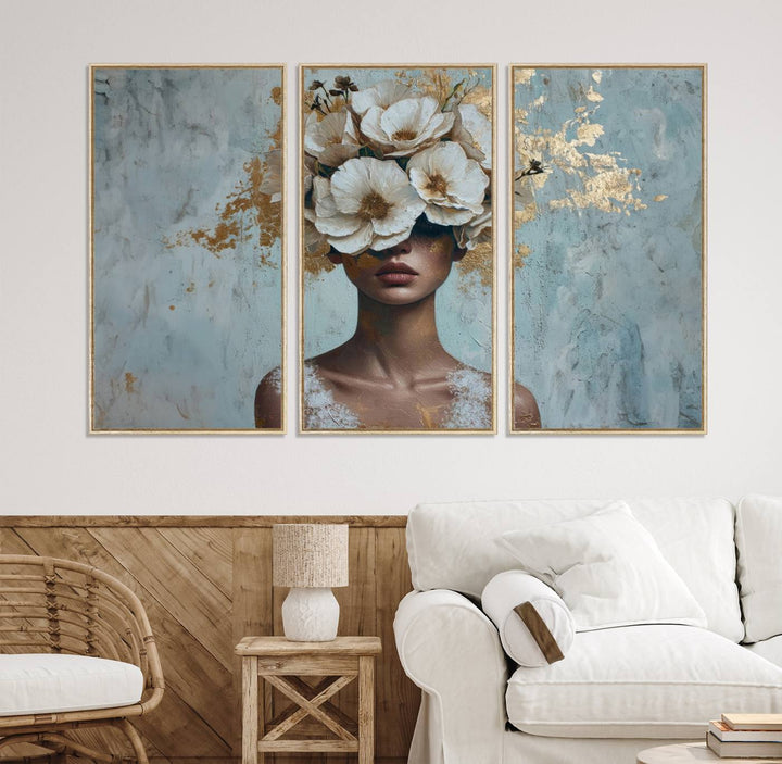 Golden Petal Wall Art: A womans face adorned with a gold floral design on a teal background, presented in a 3-panel modern glam canvas.