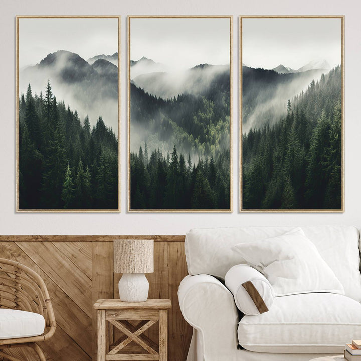 The Misty Forest Canvas Print Wall Art captures a serene misty forest scene with fog and mountains.