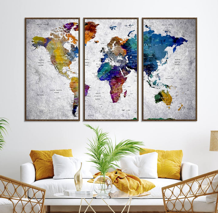 The World Map Art Canvas Print, featuring country names on a grunge-stained gray background, is perfect for stylish home decor.