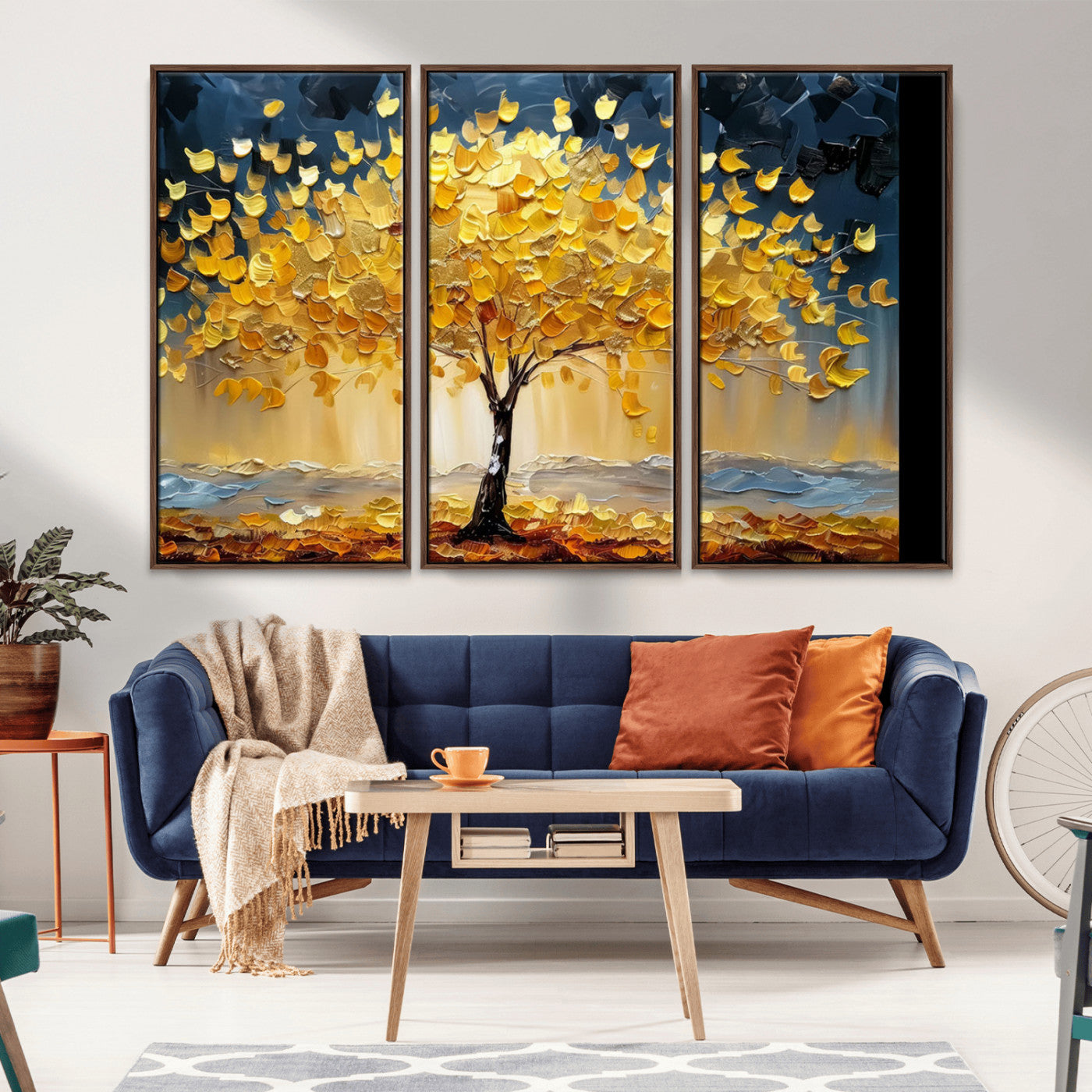 Canvas of a golden autumn tree with textured brushstrokes and moody blue skies, perfect for dramatic and vibrant home decor.