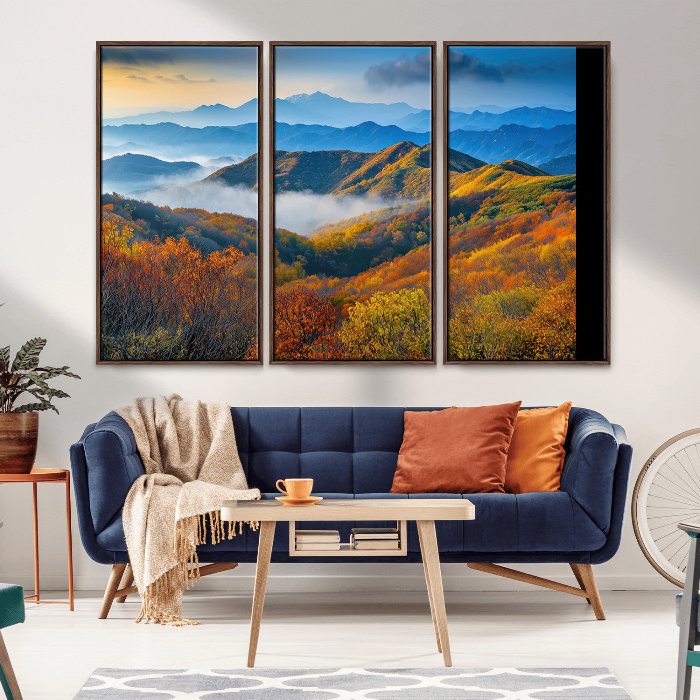 Vibrant canvas of autumn mountains with colorful trees, layered blue ridges, and soft morning fog, ideal for bright nature-themed decor.