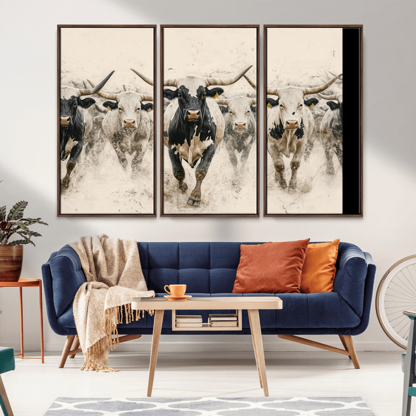 Canvas artwork of Texas Longhorn bulls walking in a dusty herd, ideal for rustic Western or country-style interior decor.