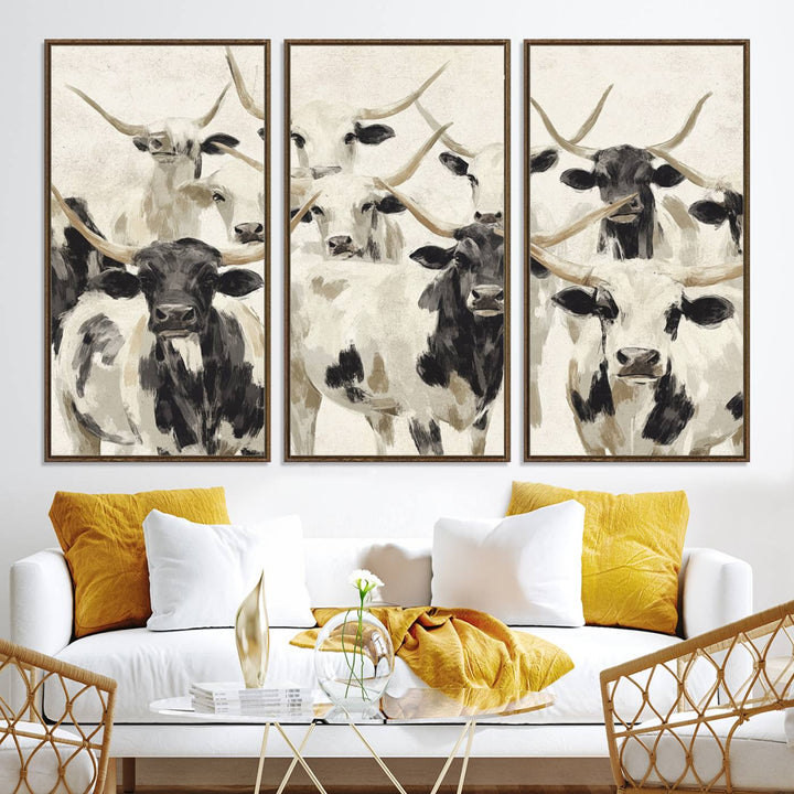 Canvas print titled Longhorn Texas Cow Drawing, depicting longhorn cattle with black and white markings, made in the USA, displayed on the wall.