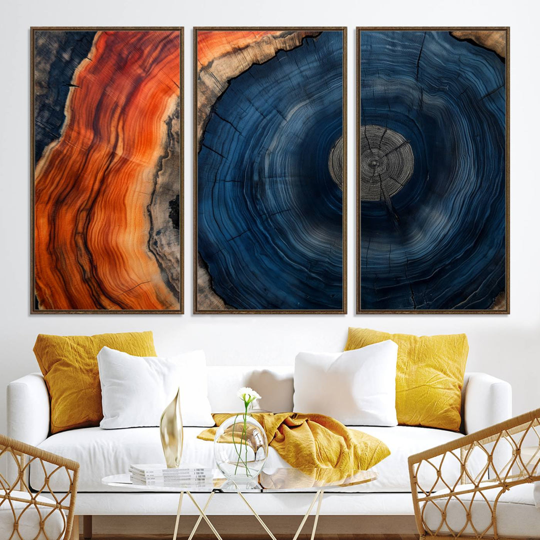 Abstract Tree Ring Wall Art Print on canvas featuring vibrant blue, orange, and brown rings with a natural rustic wood texture. Free shipping available!.