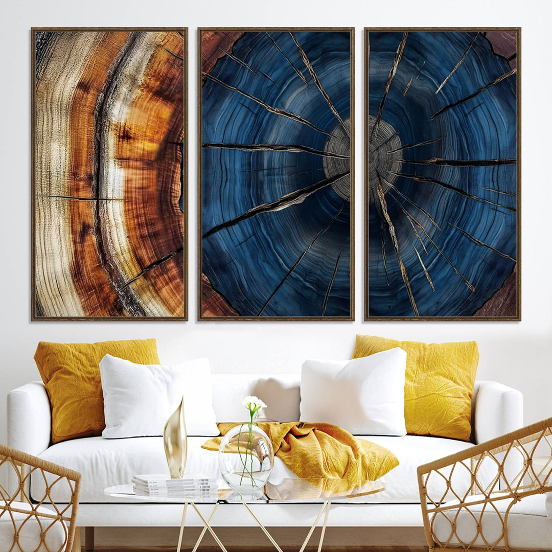 The Abstract Tree Rings Canvas Print features blue, brown, and orange rings that highlight wood grain and natures beauty.