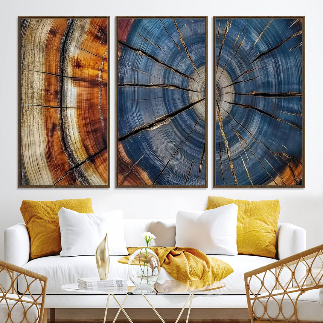 Close-up of blue, brown, and orange wood grain rings on the Abstract Tree Rings Canvas Wall Art Print.