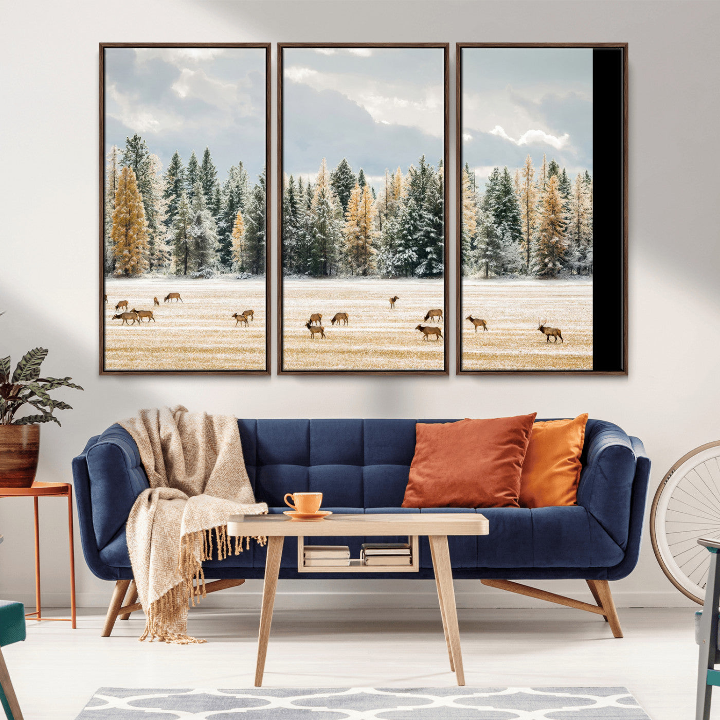 Elk herd in a snowy field with golden pine trees and frosted evergreens, ideal for neutral rustic or cabin-style home decor.