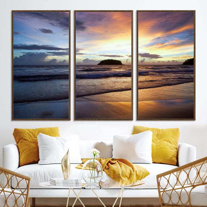 A tropical beach at sunset with waves gently washing ashore, reflecting golden and purple hues in the sky, creating a tranquil coastal scene.