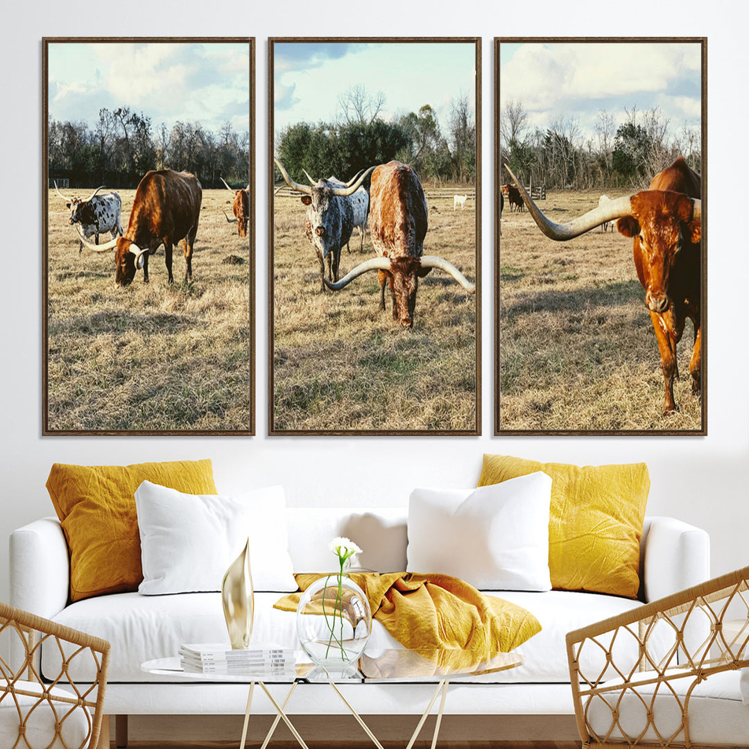 A herd of Texas Longhorn cattle grazing in an open field under a partly cloudy sky, capturing a rustic and Western ranch aesthetic.