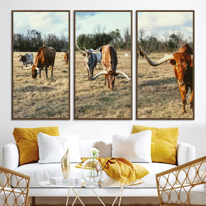 A herd of Texas Longhorn cattle grazing in an open field under a partly cloudy sky, capturing a rustic and Western ranch aesthetic.