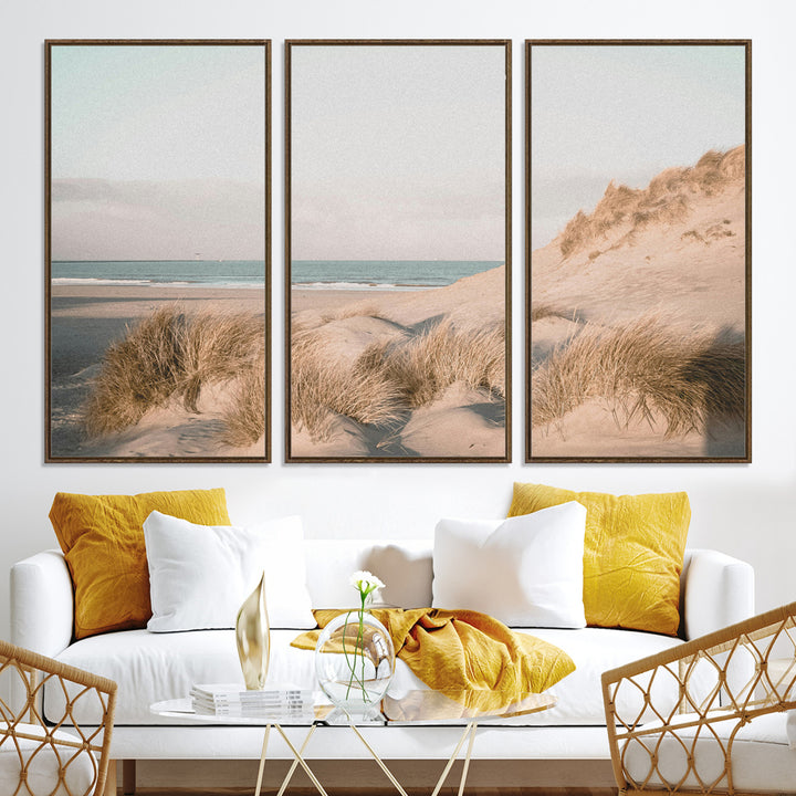 Soft pastel-toned beach scene with sand dunes, windswept grasses, and a calm ocean horizon, creating a serene coastal atmosphere.