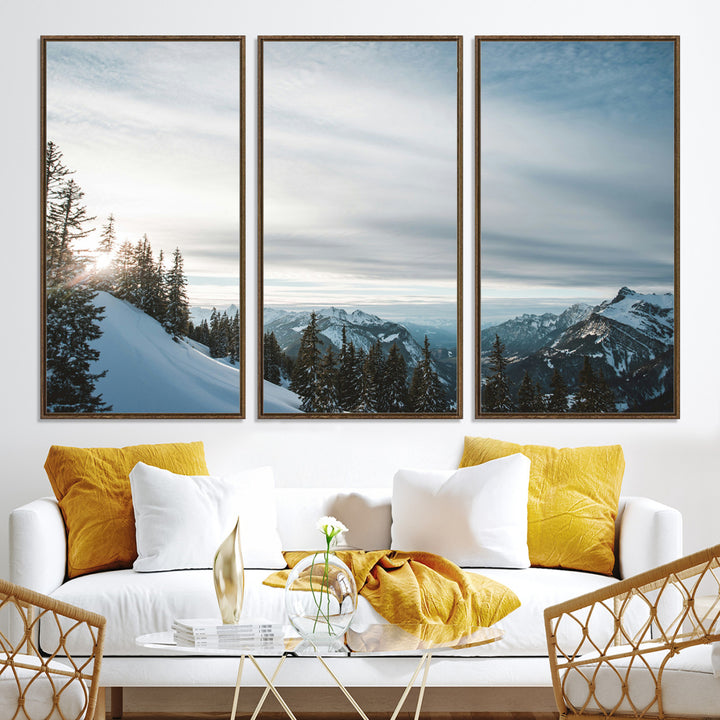 A breathtaking view of snow-covered mountains with evergreen trees and soft sunlight peeking through, creating a serene and peaceful winter scene.