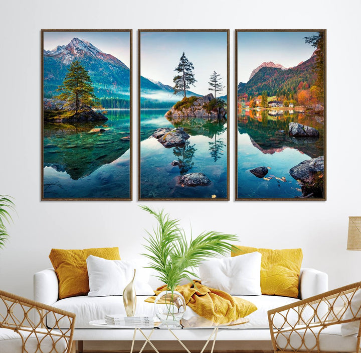 The 3-panel wall art showcases a serene mountain lake with rocky islands and trees, creating an ideal focal point for dining rooms or offices.