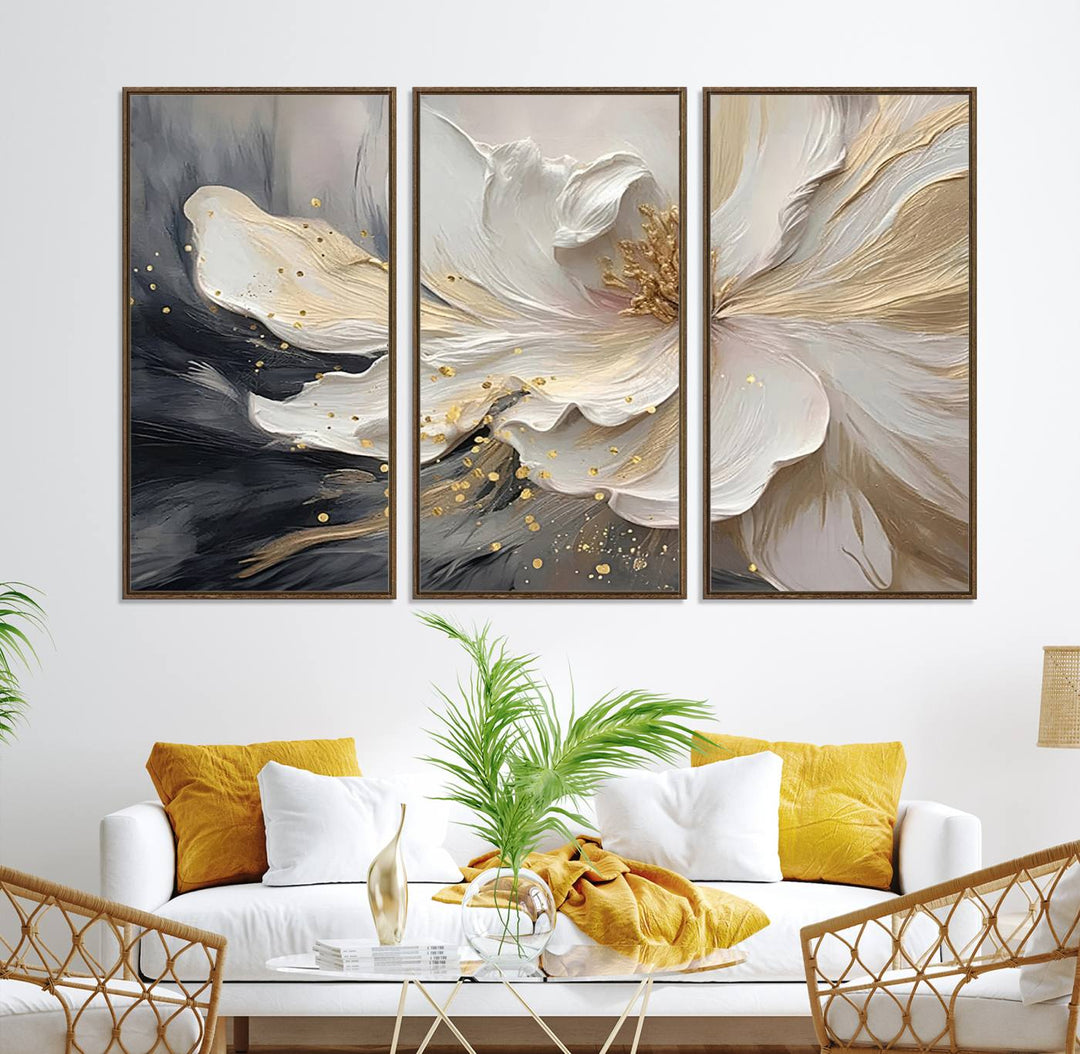 Elegant White and Gold Floral Triptych Canvas Art, a modern textured flower painting for home or office decor, features a blurred gray background.