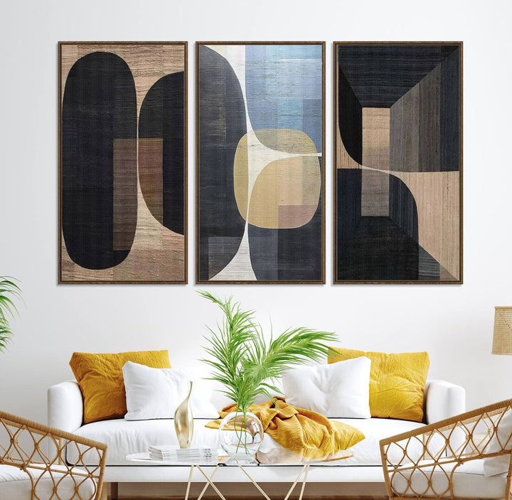 Abstract geometric wall art featuring black, gray, beige, and blue tones framed in a wooden border.