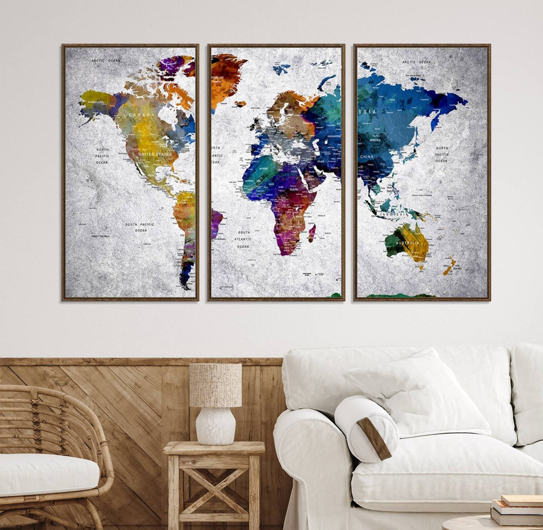 The World Map Art Canvas Print, featuring country names on a grunge-stained gray background, is perfect for stylish home decor.