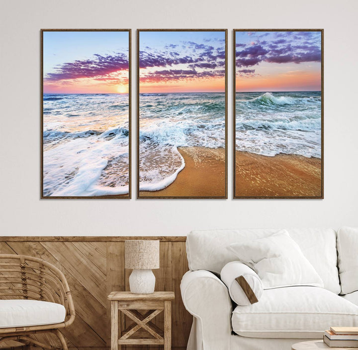 The Coastal Sunset Art Canvas Print features ocean waves beneath a vibrant sky in a stunning 3-panel seascape.