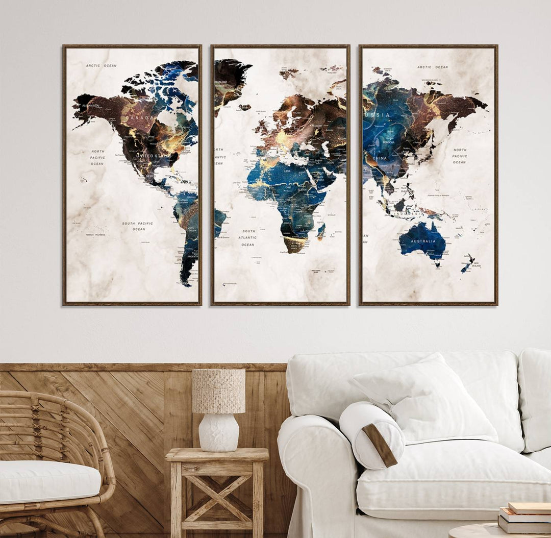 Abstract earth-toned 3-panel world map wall art featuring blues and browns, ready to hang; it showcases continents on modern canvas.