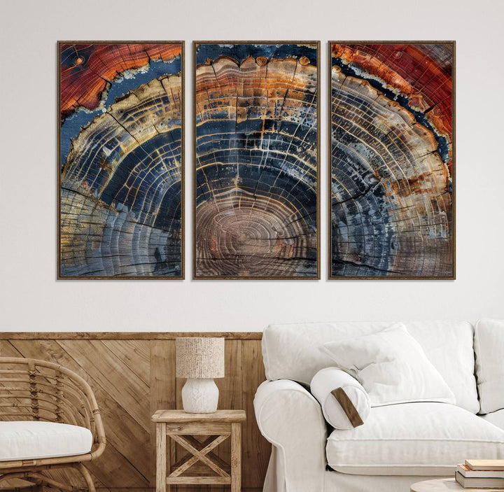 The Abstract Tree Ring Wall Art in orange, blue, and gray perfectly complements minimalist nature-inspired home decor.