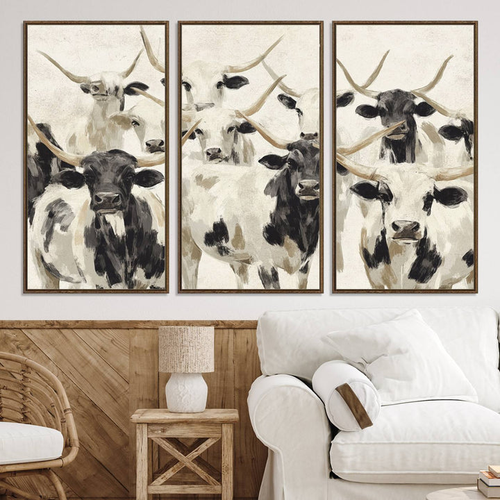 Canvas print titled Longhorn Texas Cow Drawing, depicting longhorn cattle with black and white markings, made in the USA, displayed on the wall.