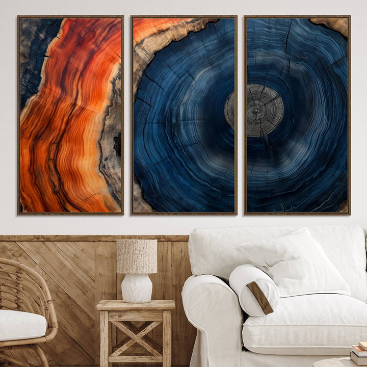 Abstract Tree Ring Wall Art Print on canvas featuring vibrant blue, orange, and brown rings with a natural rustic wood texture. Free shipping available!.