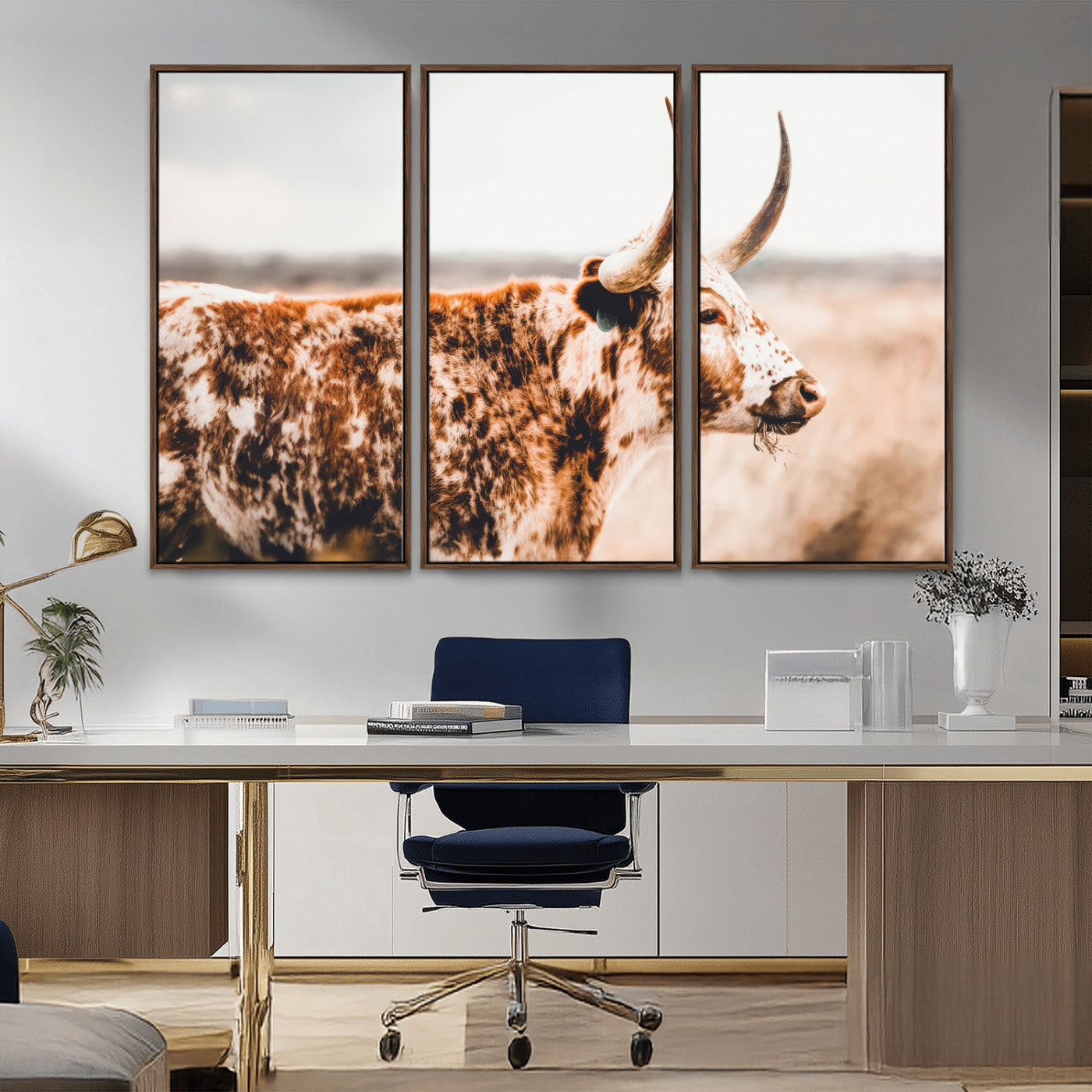 Speckled Texas longhorn with curved horns standing in a warm-toned prairie, perfect for rustic or country-style home decor.
