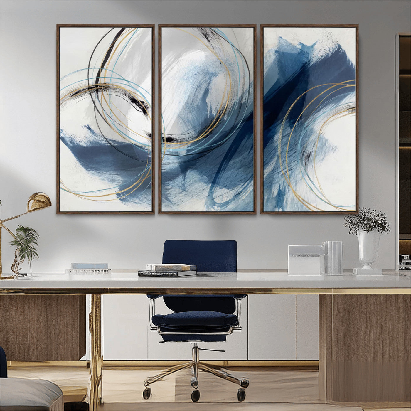 Abstract wall art featuring dynamic brush strokes in shades of blue and gray, overlaid with delicate circular line patterns in gold, black, and light blue on a white background.