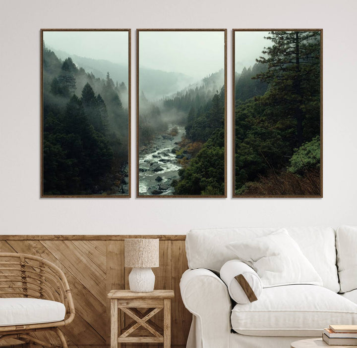 The Misty Forest Wall Art features a serene landscape with a misty river and evergreens, ideal for enhancing the ambiance of any living room or cabin.