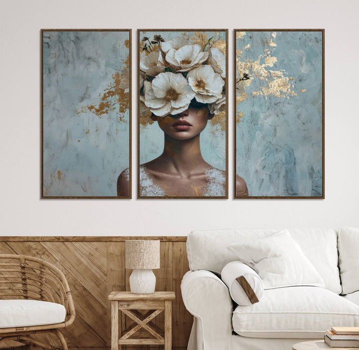 Golden Petal Wall Art: A womans face adorned with a gold floral design on a teal background, presented in a 3-panel modern glam canvas.