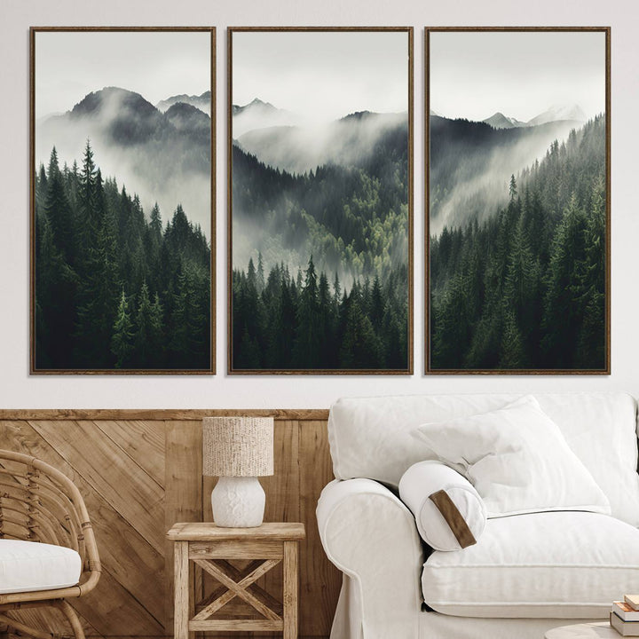 The Misty Forest Canvas Print Wall Art captures a serene misty forest scene with fog and mountains.