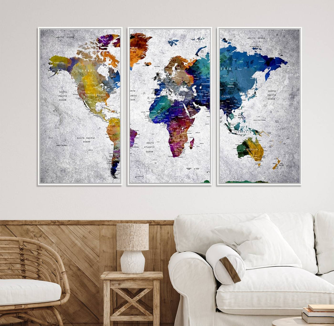 The World Map Art Canvas Print, featuring country names on a grunge-stained gray background, is perfect for stylish home decor.