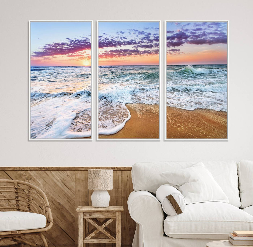 The Coastal Sunset Art Canvas Print features ocean waves beneath a vibrant sky in a stunning 3-panel seascape.